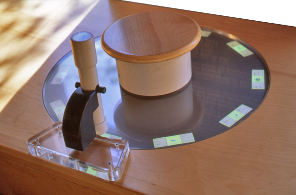 Slide-based food viewing station, tailored for small hands, encouraging observational learning.