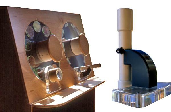 A custom-designed children’s microscope and turntable with illuminated petri dishes showcasing food samples for magnified viewing.