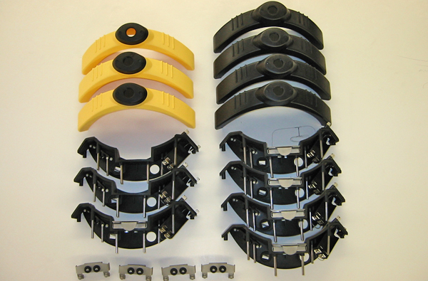 Close-up of precision-machined internal components of the night vision unit, arranged for final assembly.