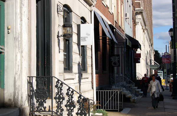 Distant shot from street level, contextualizing signage within the streetscape