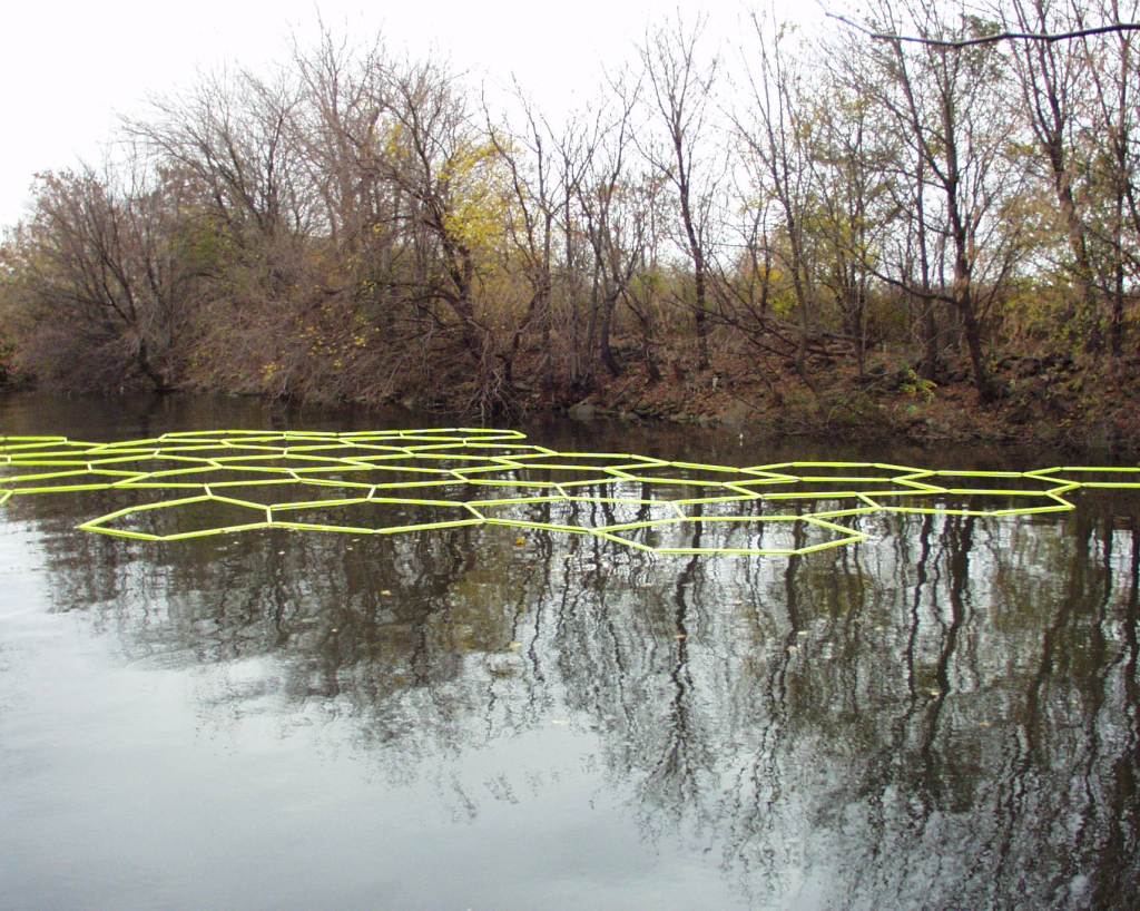 Edward Dormer's Molecular Notation with mirror-like reflections on Delaware River creating dialogue between art and nature