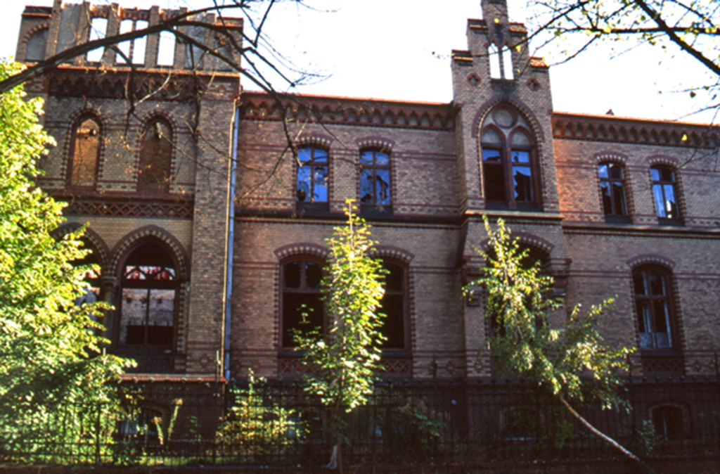 Exterior view of the Officers' Casino at Schiffbaubauergasse Potsdam Germany, a Gothic-style brick building with arched windows that housed Edward Dormer's One Day Four Hours installation.